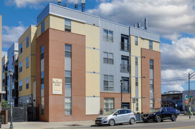 Exterior view of Brunetti Lofts a brick and siding building